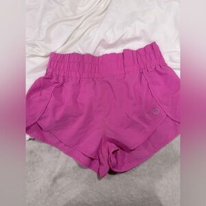 Pink Athletic Shorts with Elastic Waistband and Curved Hem